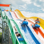 Children having fun on exciting slide with friends at Massanutten outdoor water park