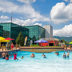 Families spend time together swimming in Massanutten wave pool at Massanutten Outdoor water park