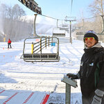 A lift operator running a ski lift at Massanutten Resort