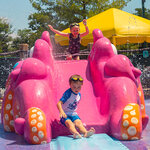 Children smiling while playing in kid-zone at Massanutten outdoor waterpark