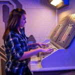 A woman solving a puzzle in the Singularity Escape Room