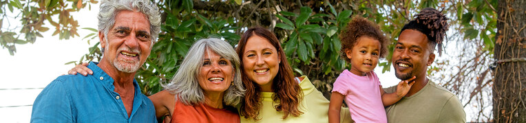 A photo of a smiling multigenerational family