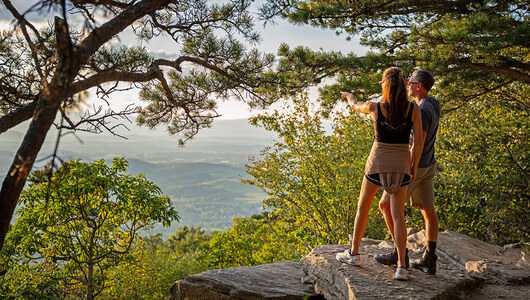 A couple standing at an overlook at Massanutten Resort