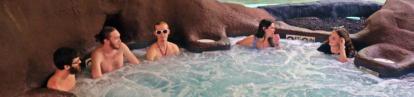 Adults enjoy adult only relaxing hot tub at Massanutten indoor waterpark