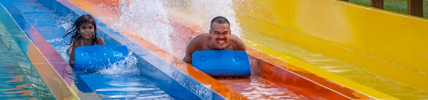 Father and Daughter enjoying race slide at Massanutten Outdoor water park