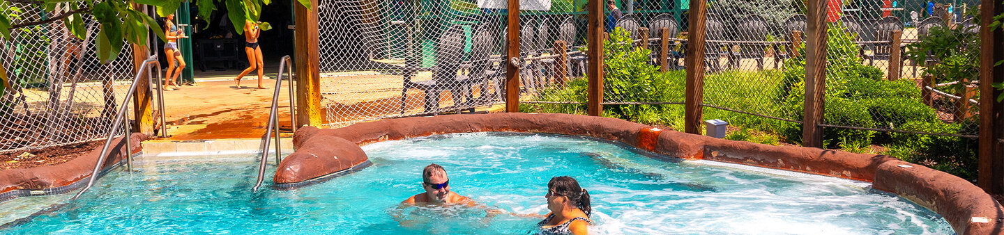 Guests relaxing in hot tub at Massanutten indoor water park
