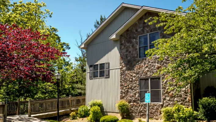 Exterior photo of Woodstone Meadows condo building
